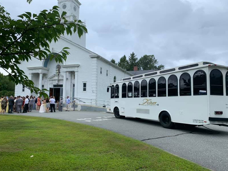 charter bus in front of church