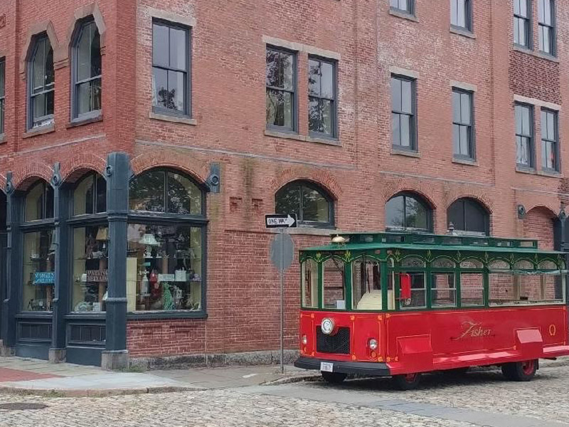 trolly outside of brick building