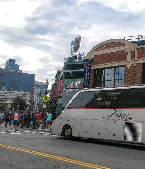 fisher bus parked outside of stadium