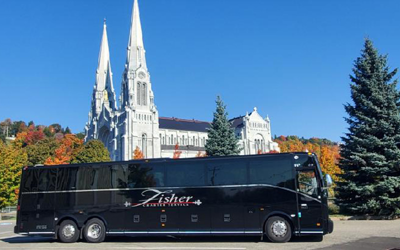 Tour bus in front of an old church
