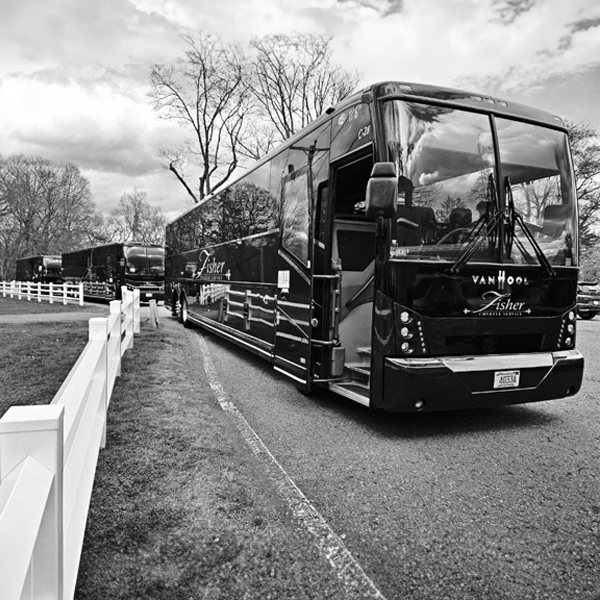 black and white photo of three charter buses by Fisher Bus Inc